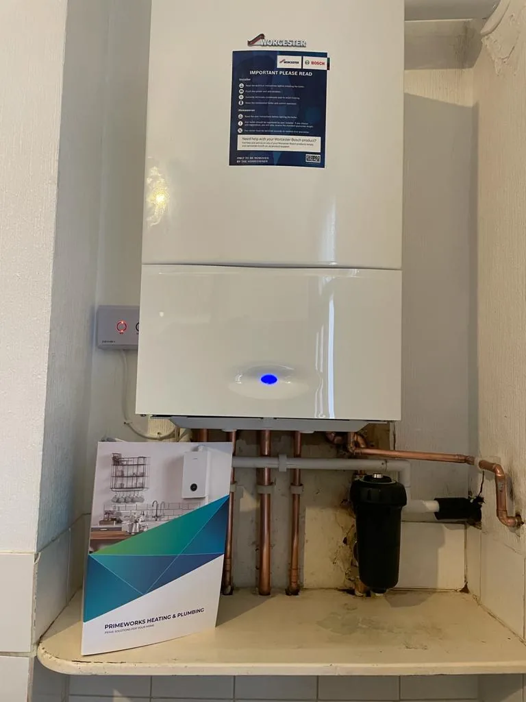 Compact wall-mounted boiler in a utility cupboard
